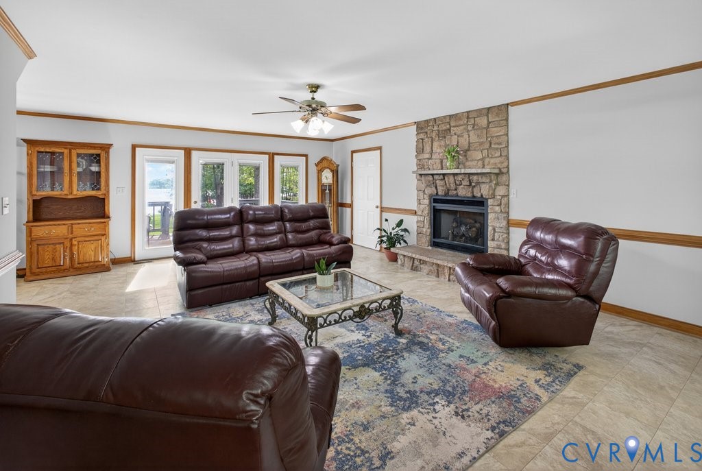 173 Covenant Way Bumpass, VA 23024 - Photo 23 of 63 Living area featuring a stone fireplace, light-col