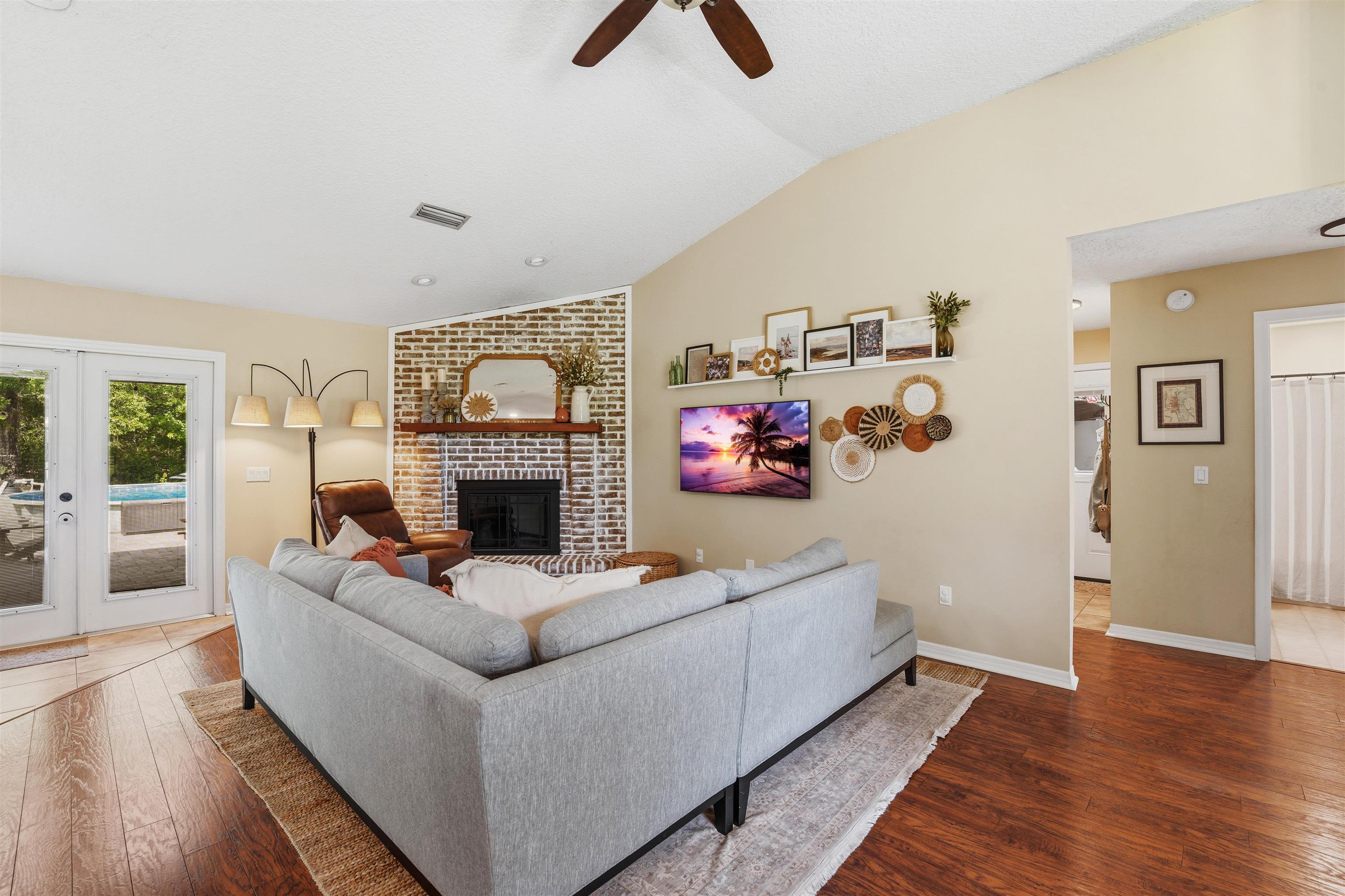 1805 Bennett Road St. Augustine, FL 32092 - Photo 9 of 65 a living room with furniture and a fireplace