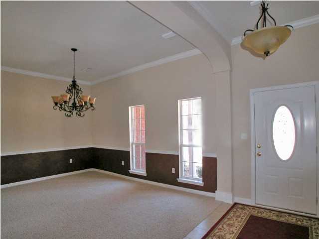 4630 Hermosa Road Crestview, FL 32539 - Photo 6 of 29 a very nice looking room with a window and chandelier