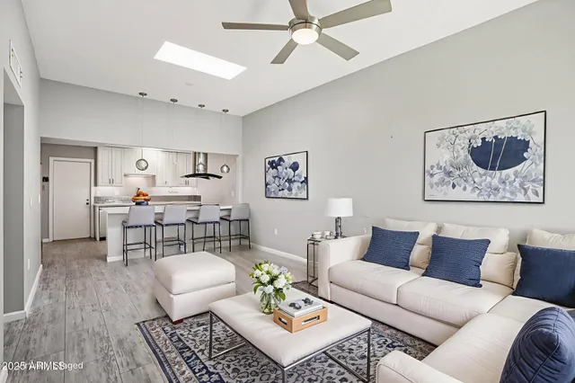 a living room with furniture and a rug