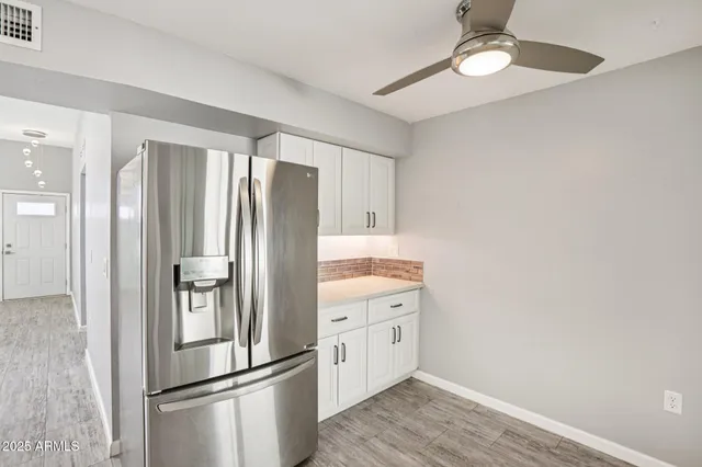 a kitchen with a sink cabinets and window