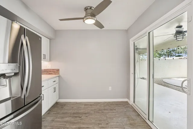 a living room with furniture and book shelf