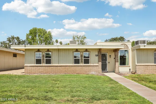 front view of a house with a yard
