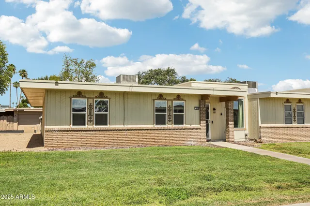 front view of a house with a yard