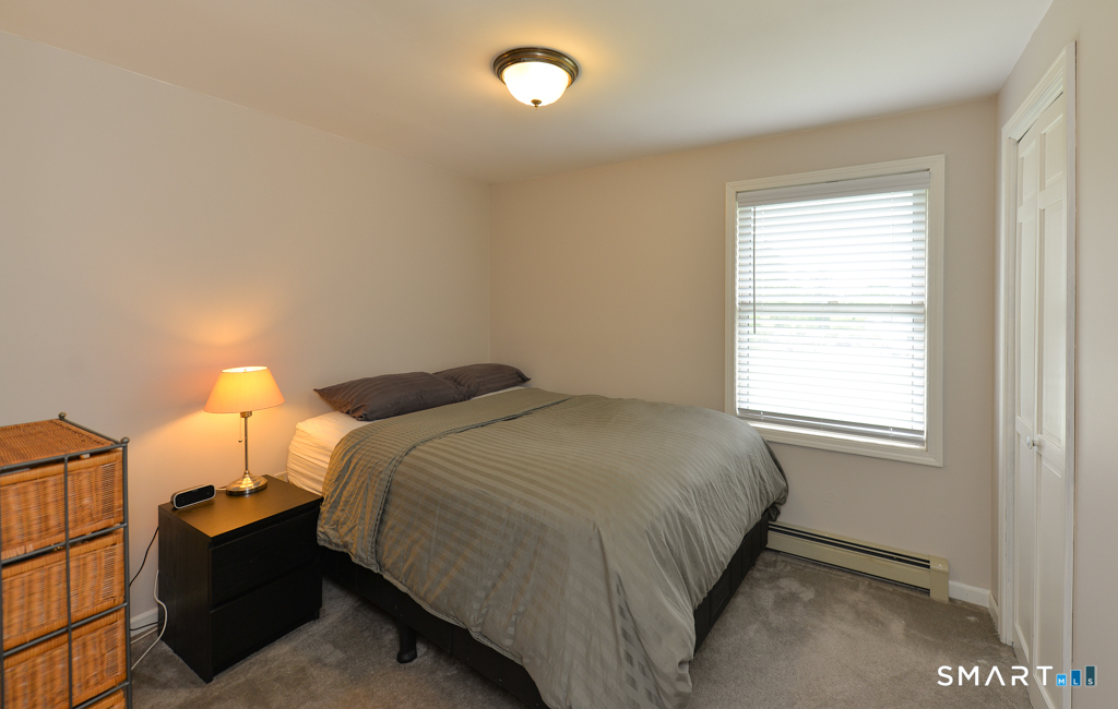 109 Harrison Lane Bethlehem, CT 06751 - Photo 20 of 28 a bedroom with a bed and a window