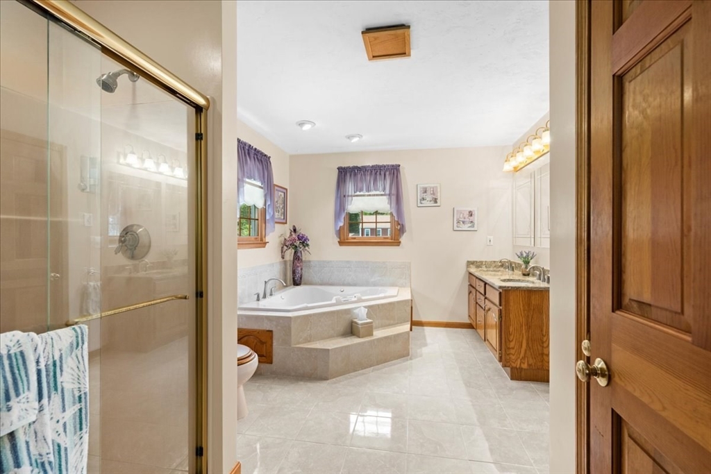 27 Crestview Drive Uxbridge, MA 01569 - Photo 15 of 39 a spacious bathroom with a tub sink and mirror