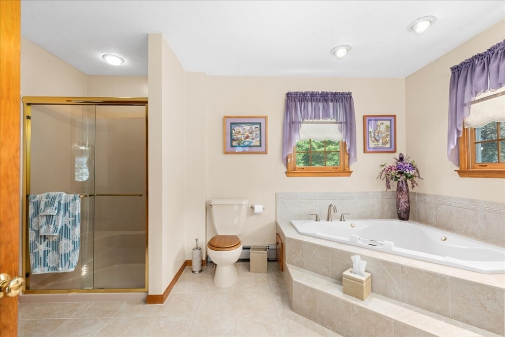 27 Crestview Drive Uxbridge, MA 01569 - Photo 16 of 39 a spacious bathroom with a bathtub shower sink and toilet
