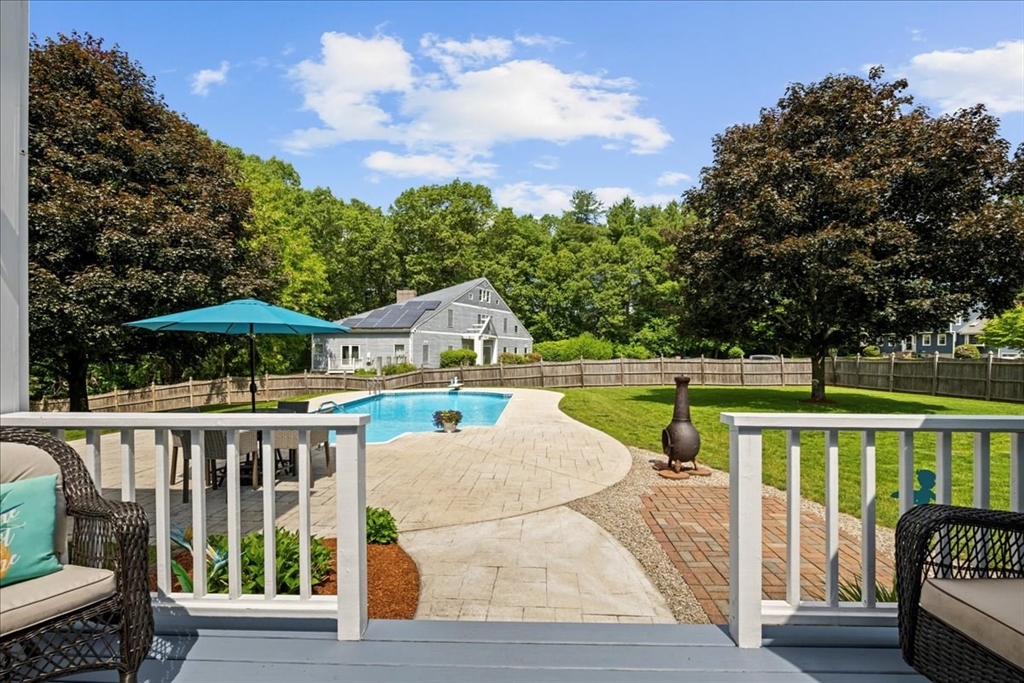 27 Crestview Drive Uxbridge, MA 01569 - Photo 22 of 39 a view of a house with wooden deck and furniture