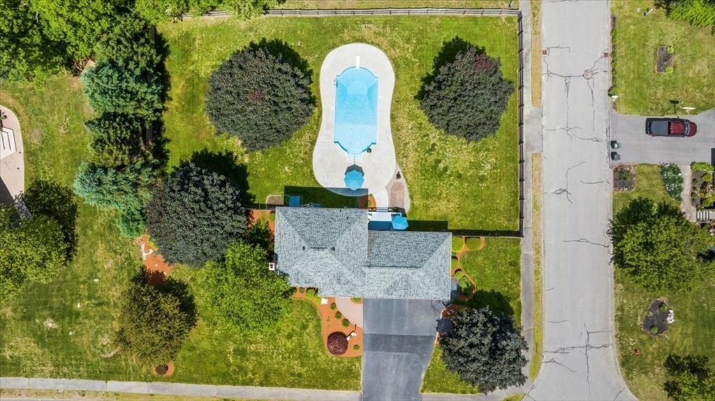 27 Crestview Drive Uxbridge, MA 01569 - Photo 28 of 39 an aerial view of a house with swimming pool and large trees