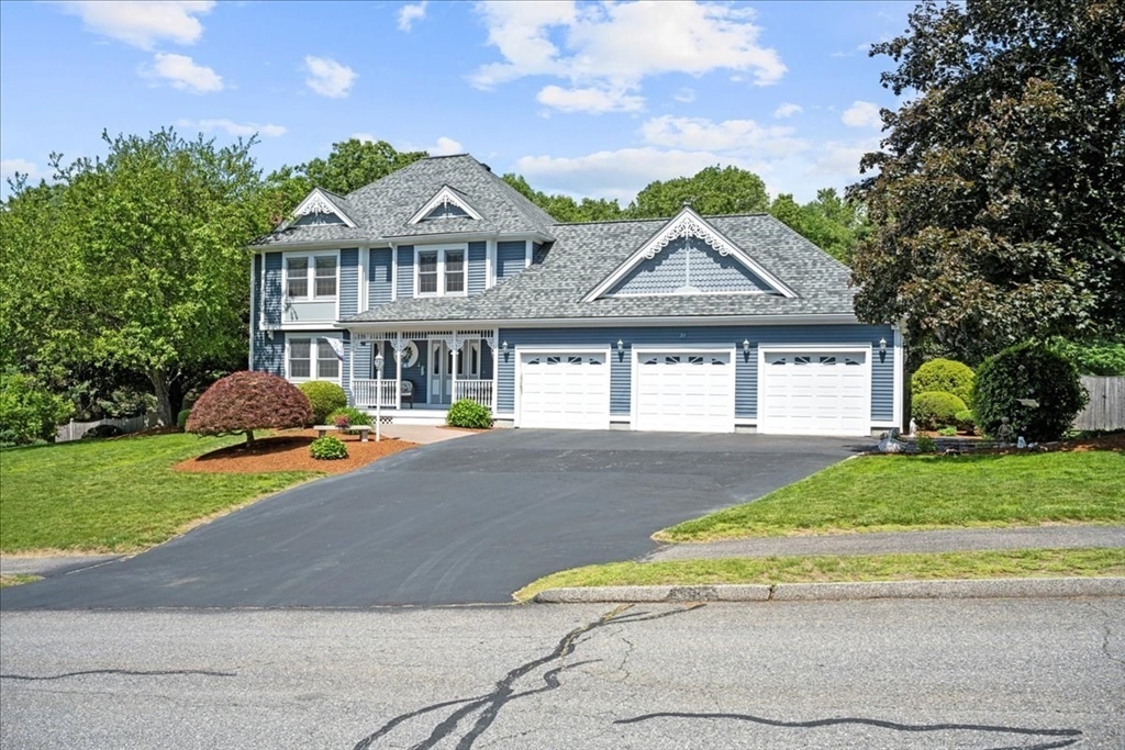 27 Crestview Drive Uxbridge, MA 01569 - Photo 36 of 39 a front view of a house with a yard and garage