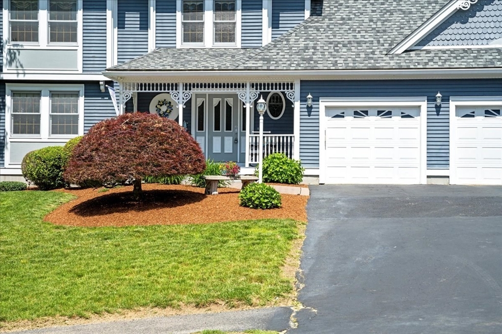 27 Crestview Drive Uxbridge, MA 01569 - Photo 37 of 39 a front view of a house with garden