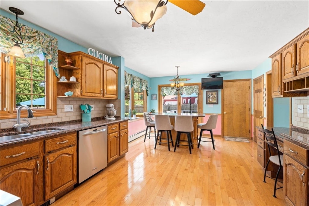 27 Crestview Drive Uxbridge, MA 01569 - Photo 6 of 39 a large kitchen with a table and chairs