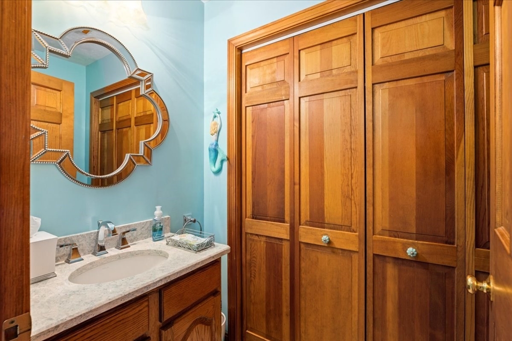 27 Crestview Drive Uxbridge, MA 01569 - Photo 10 of 39 a bathroom with a sink and a mirror