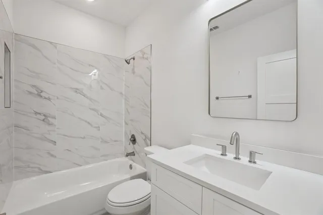 a spacious bathroom with double sink and a mirror