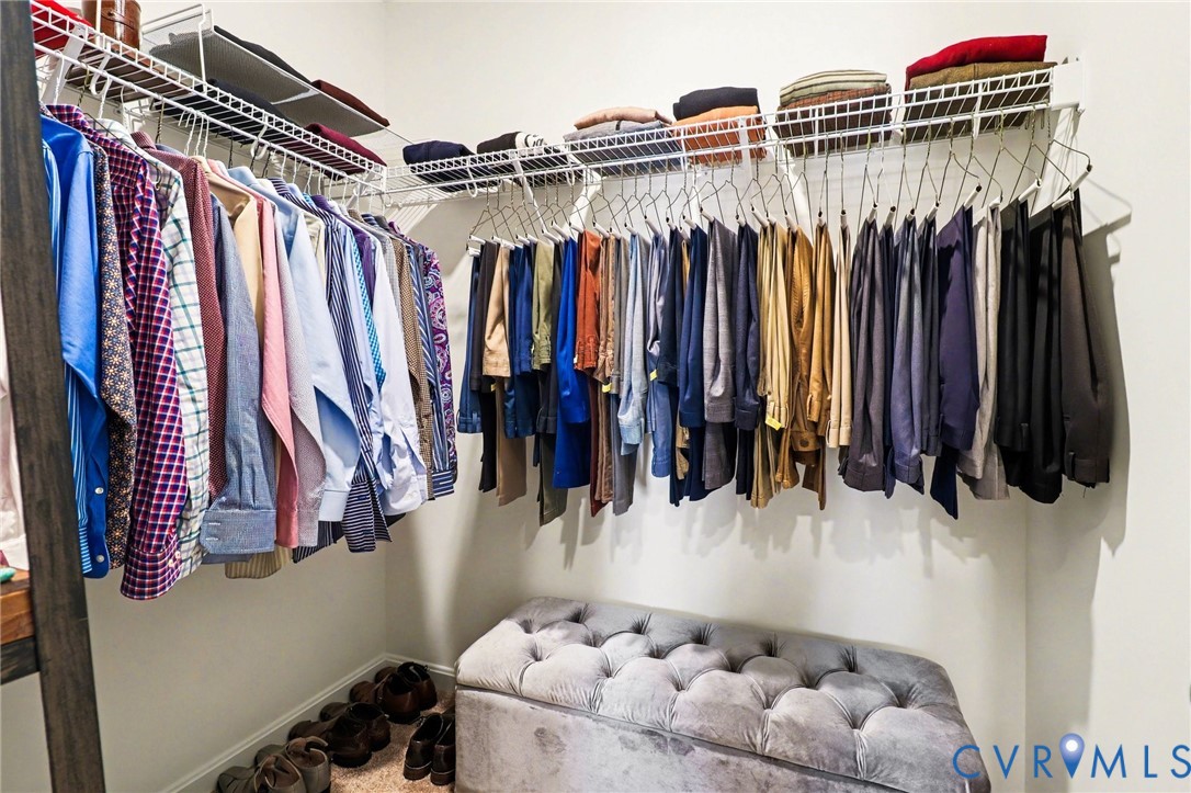 17075 Rollins Road Bowling Green, VA 22427 - Photo 15 of 23 a view of walk in closet with clothes and shoes