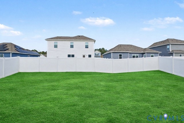 17075 Rollins Road Bowling Green, VA 22427 - Photo 4 of 16 a front view of a house with a yard and garage