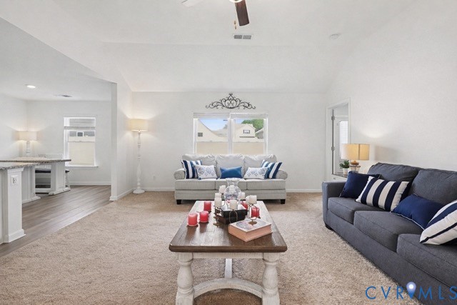 17075 Rollins Road Bowling Green, VA 22427 - Photo 5 of 16 a living room with furniture and a chandelier