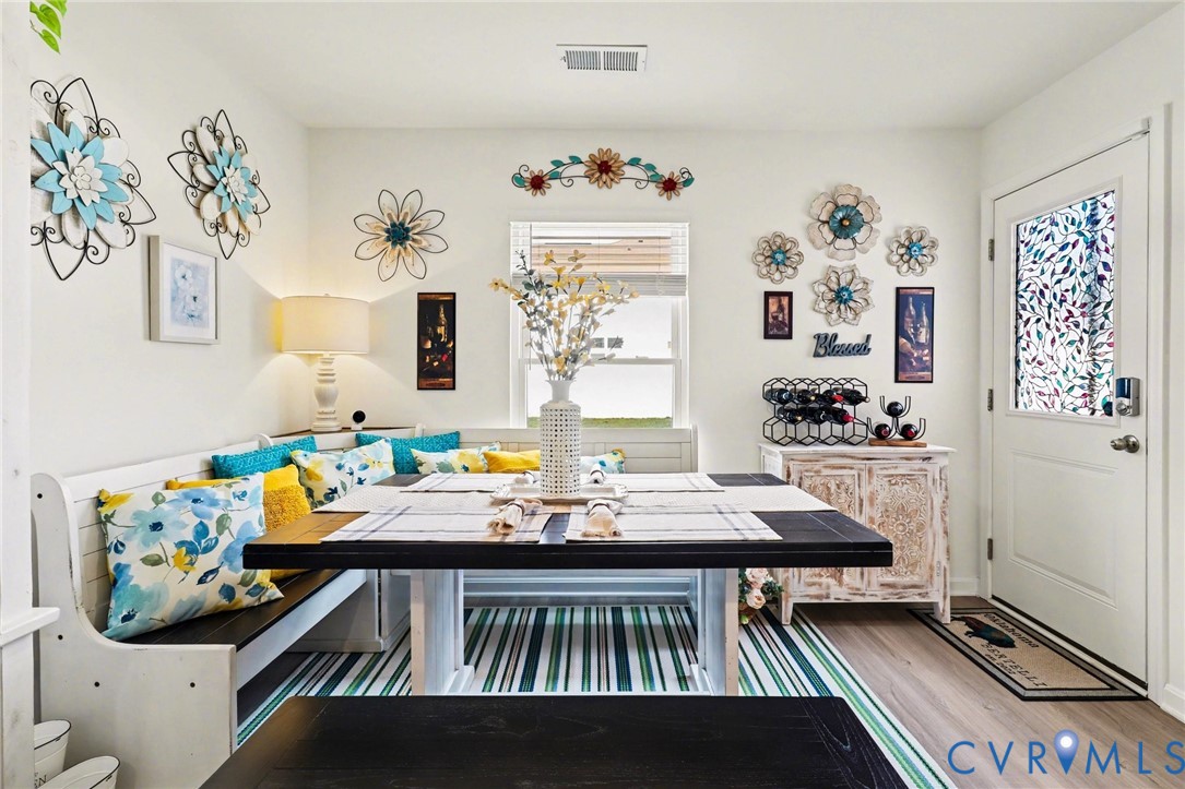 17075 Rollins Road Bowling Green, VA 22427 - Photo 7 of 23 a view of a dining room with furniture and chandelier