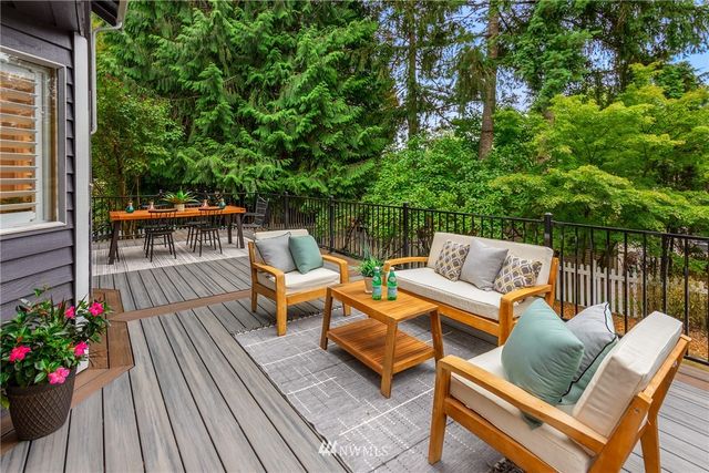a outdoor living space with furniture and flowers