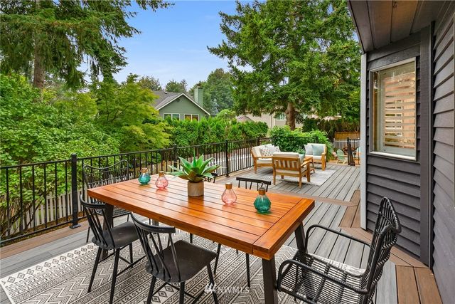 a view of an outside dining space with furniture