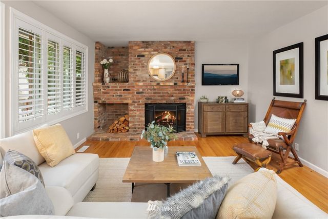 a living room with furniture fireplace and flat screen tv