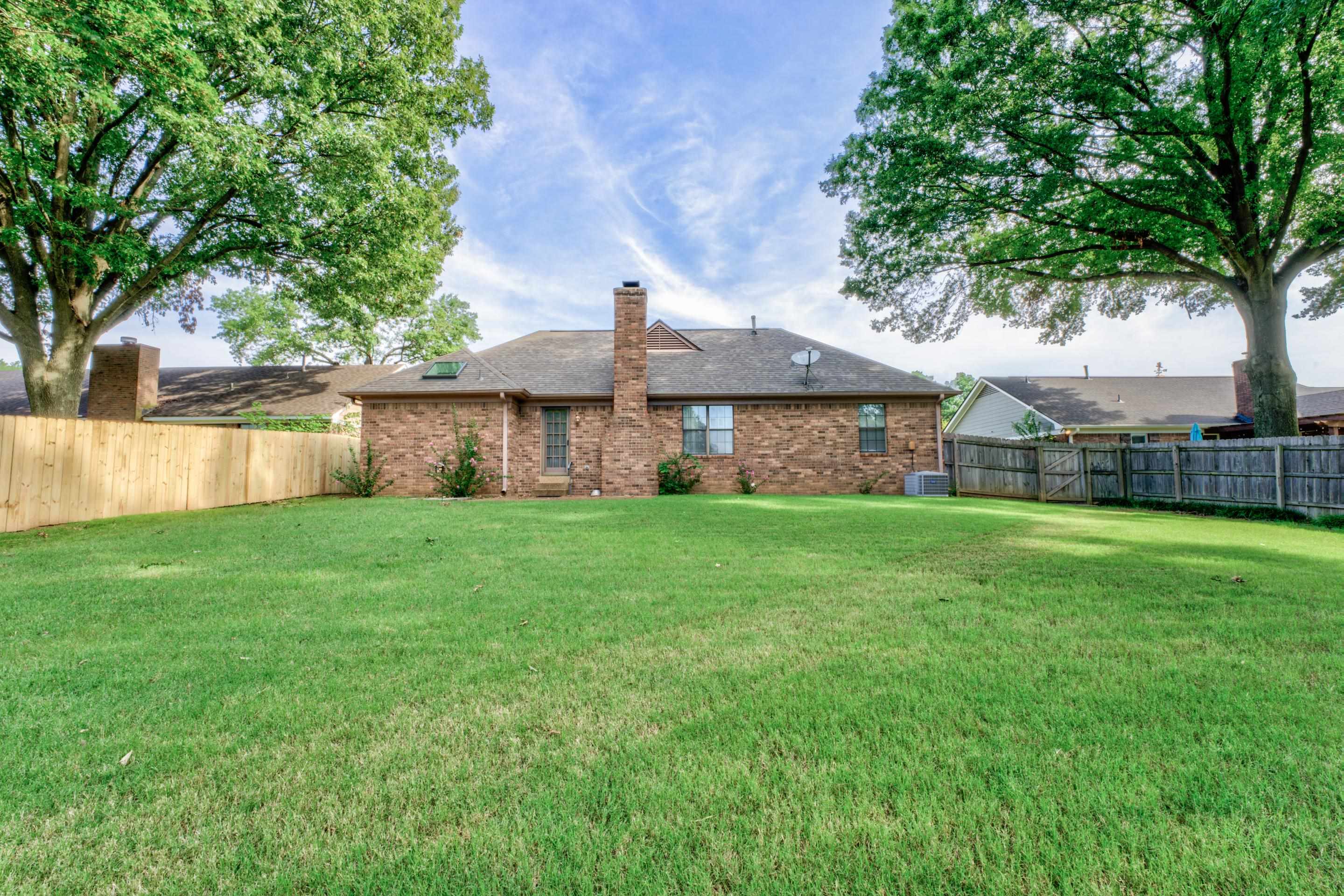 6433 Yale Road Bartlett, TN 38134 - Photo 22 of 24 a view of a house with a yard