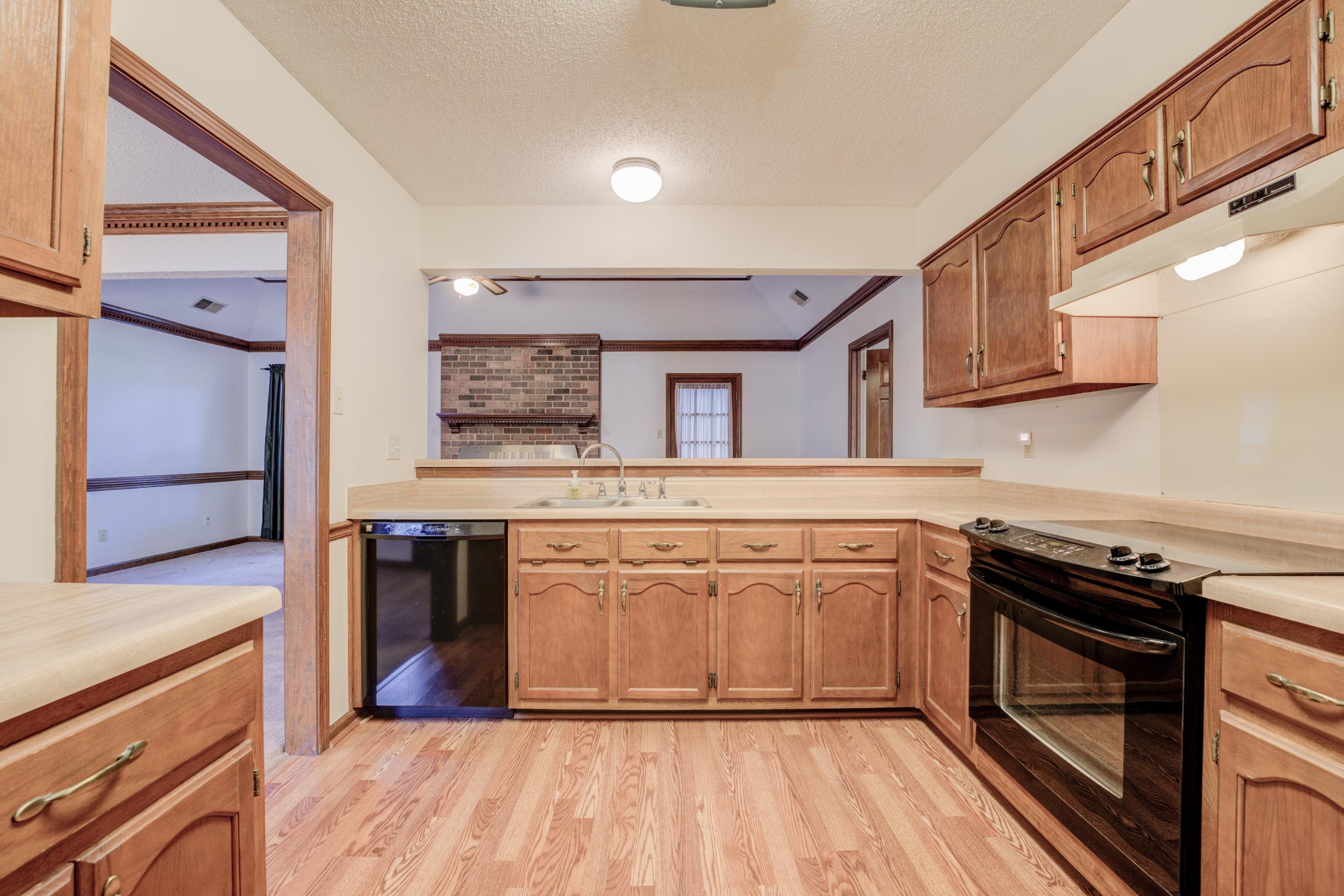 6433 Yale Road Bartlett, TN 38134 - Photo 8 of 24 a kitchen with stainless steel appliances granite countertop a stove a sink and a refrigerator