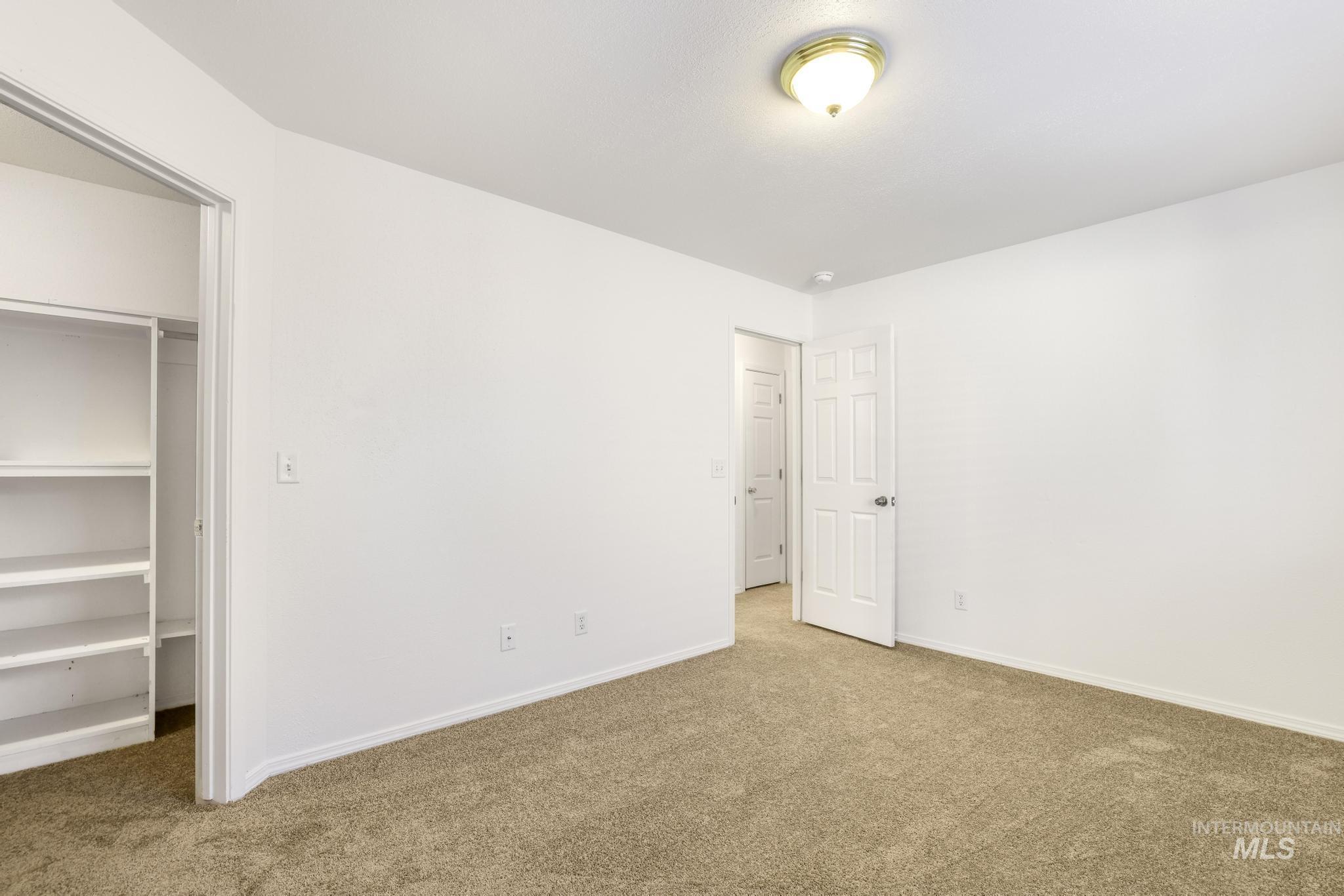 1218 Inca Drive Twin Falls, ID 83301 - Photo 16 of 27 Unfurnished bedroom featuring a spacious closet and carpet floors