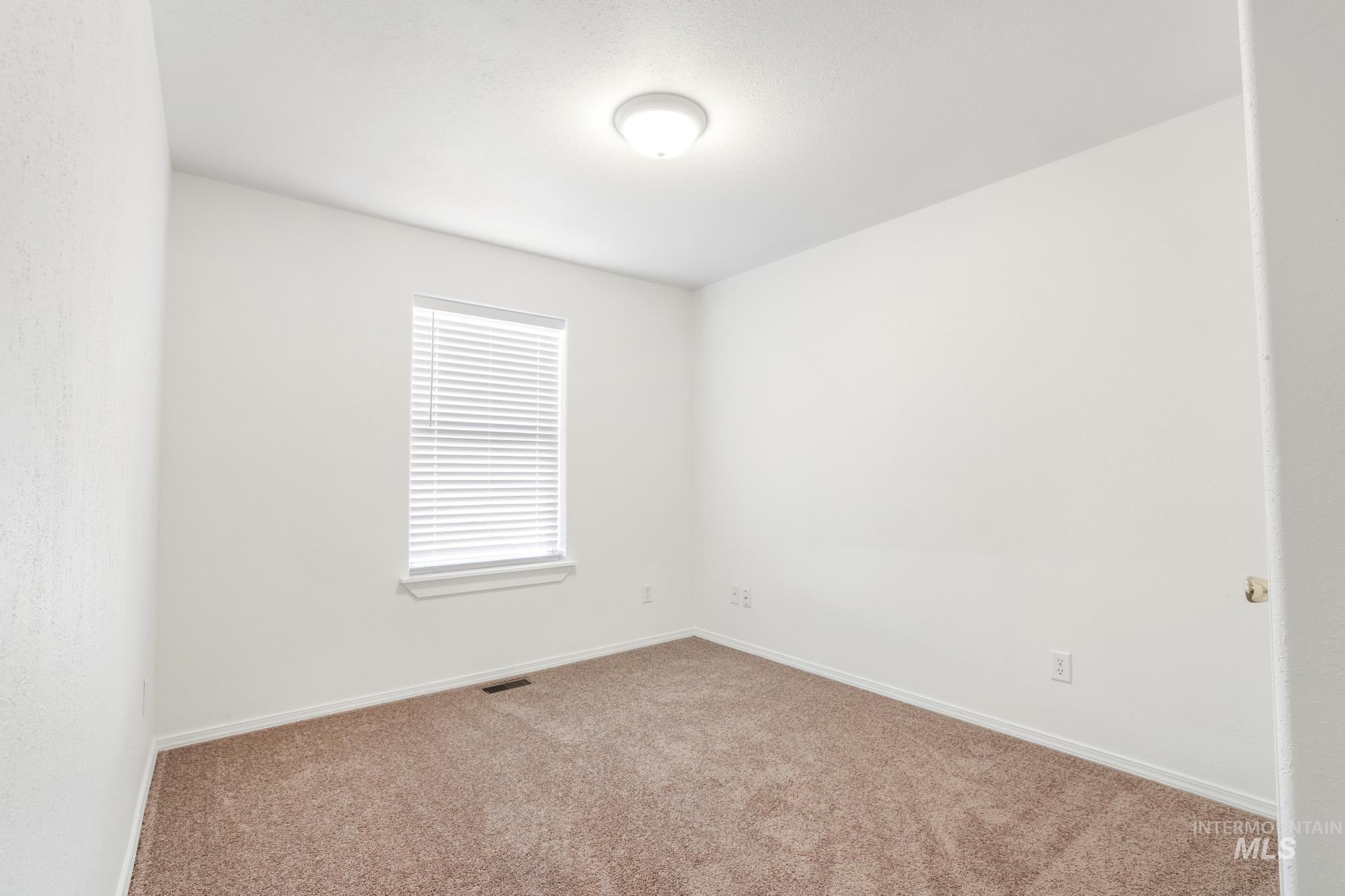 1218 Inca Drive Twin Falls, ID 83301 - Photo 19 of 27 Unfurnished room featuring carpet and baseboards