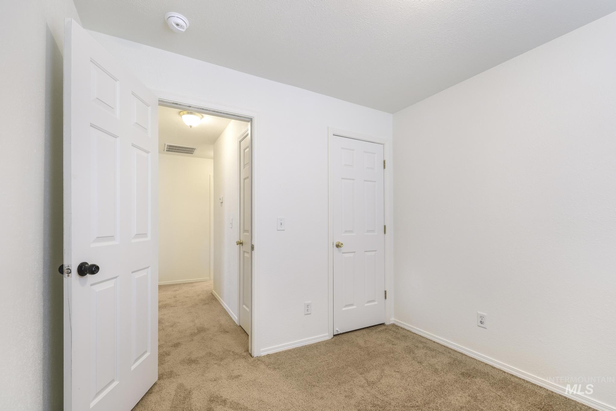 1218 Inca Drive Twin Falls, ID 83301 - Photo 22 of 27 Unfurnished bedroom featuring light carpet and baseboards