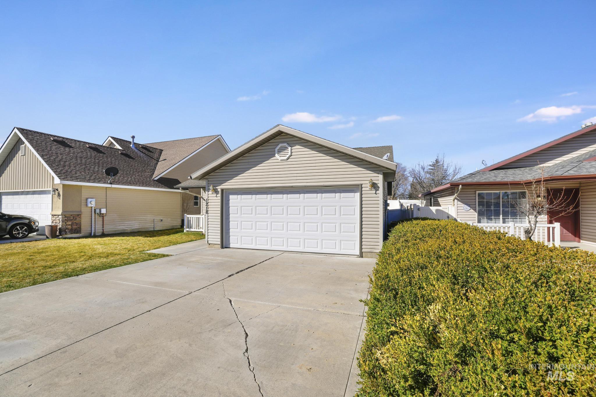 1218 Inca Drive Twin Falls, ID 83301 - Photo 26 of 27 View of front of property with concrete driveway and a garage