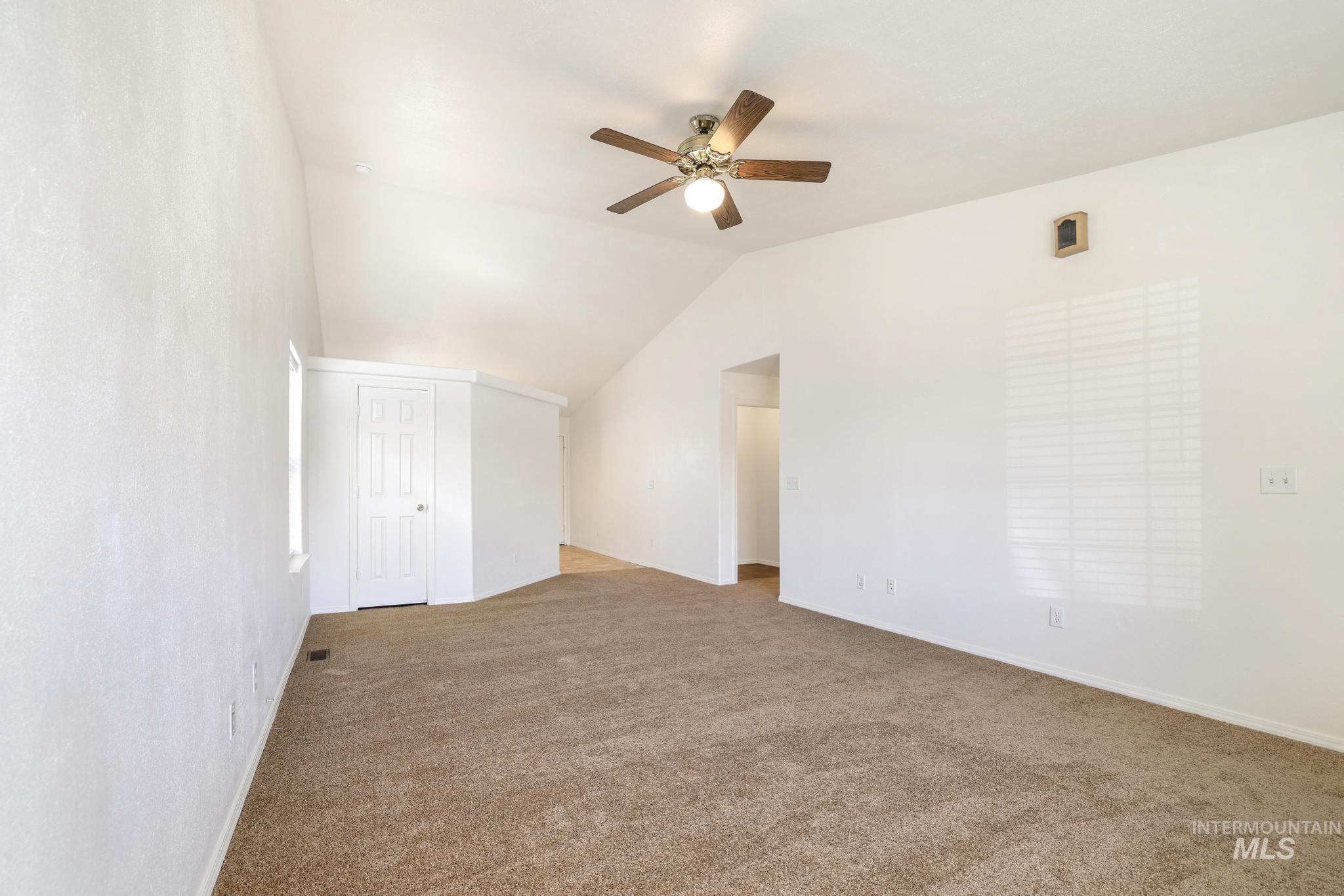 1218 Inca Drive Twin Falls, ID 83301 - Photo 5 of 27 Bonus room with carpet flooring, ceiling fan, and vaulted ceiling