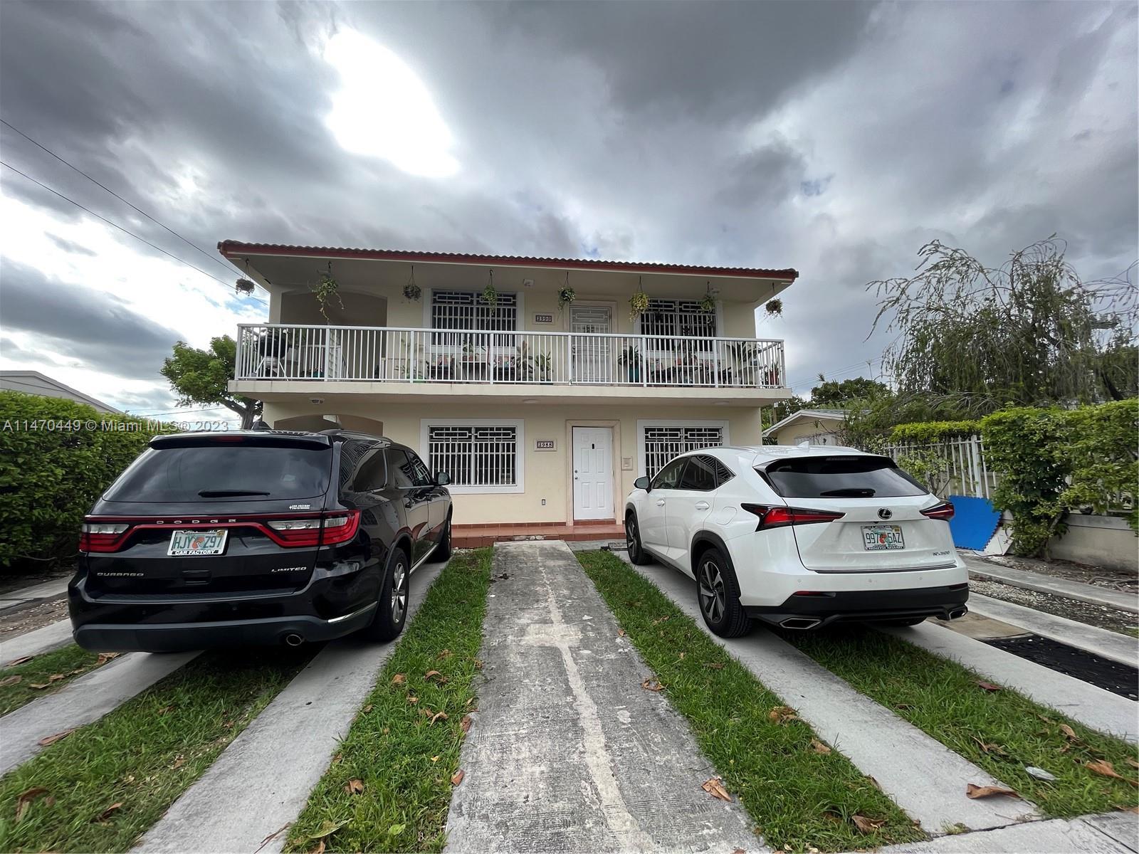 2988 Southwest 11th Street, Unit 2988 Miami, FL 33135 - Photo 1 of 22 a front view of a house with a garden