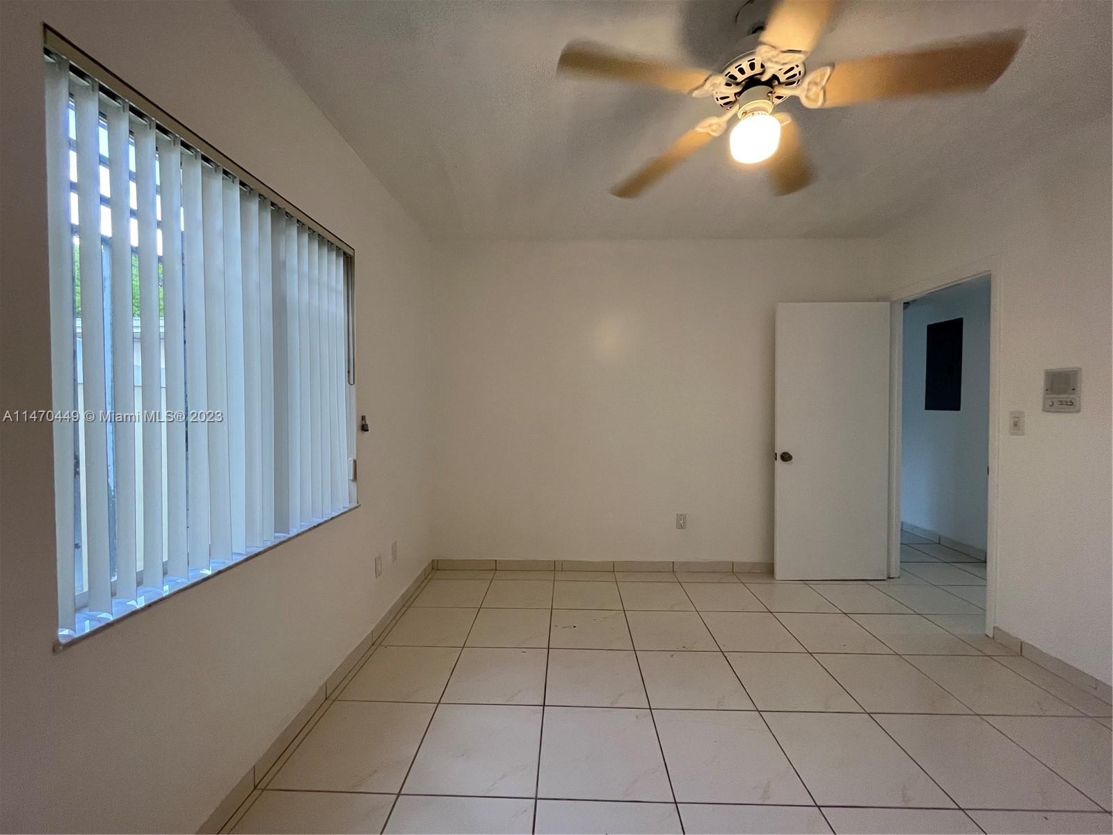2988 Southwest 11th Street, Unit 2988 Miami, FL 33135 - Photo 16 of 22 a view of an empty room with a window