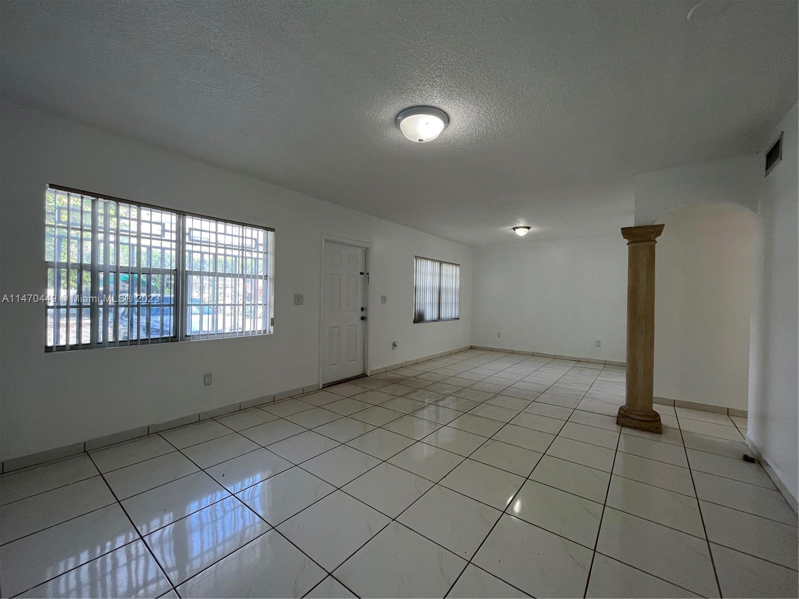 2988 Southwest 11th Street, Unit 2988 Miami, FL 33135 - Photo 20 of 22 a view of an empty room and window