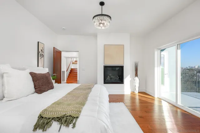 a bedroom with a bed and a fireplace