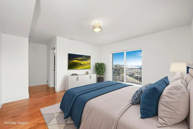 a bedroom with a bed and a couch