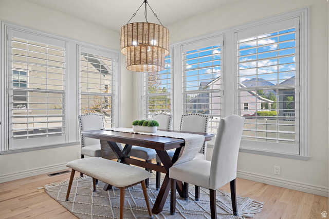 927 Iris Lane Mapleton, UT 84664 - Photo 12 of 31 Hardwood-finish flooring, plantation shutters, and a chandelier with a woven drum shade