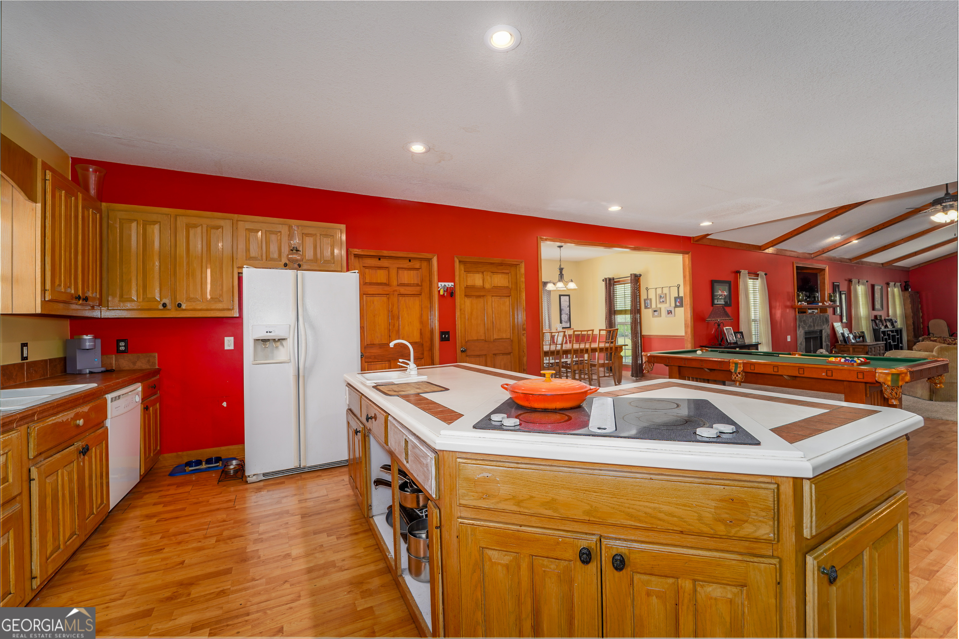 3300 Connor Lane Waycross, GA 31503 - Photo 25 of 42 a view of a kitchen with kitchen island a sink a stove and a refrigerator