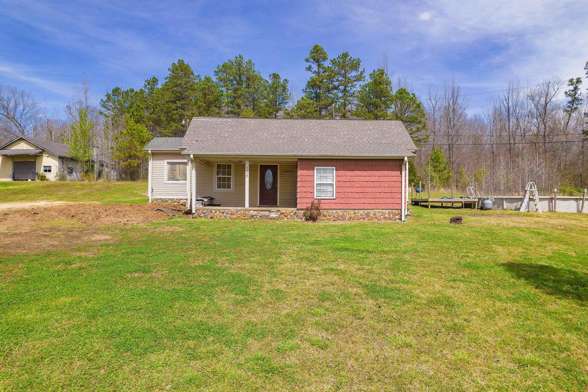 3249 Beech Bluff Road Beech Bluff, TN 38313 - Photo 1 of 32 a front view of a house with a yard
