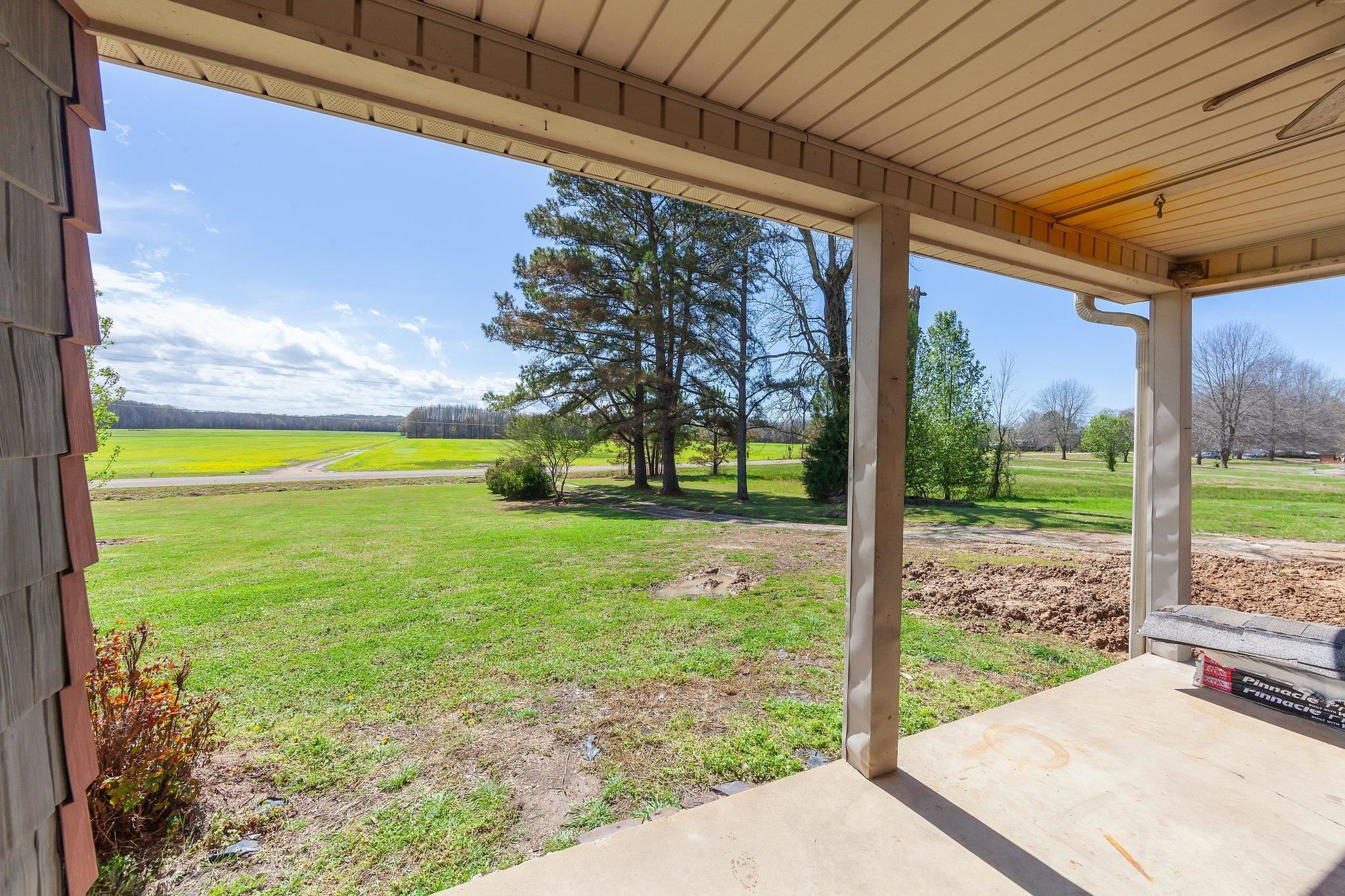 3249 Beech Bluff Road Beech Bluff, TN 38313 - Photo 16 of 32 a view of a yard with porch