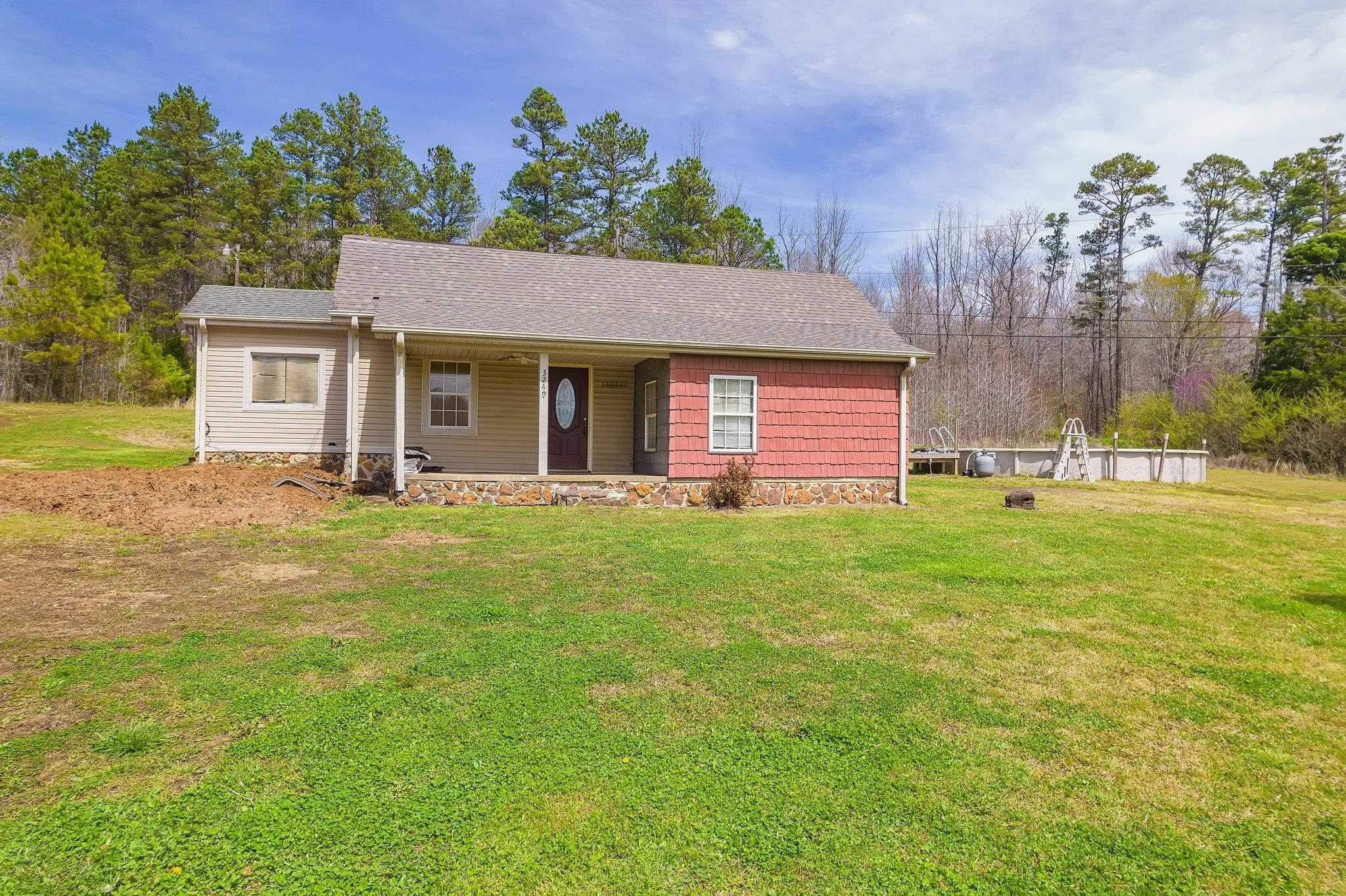 3249 Beech Bluff Road Beech Bluff, TN 38313 - Photo 2 of 32 a front view of house with yard and trees in the background