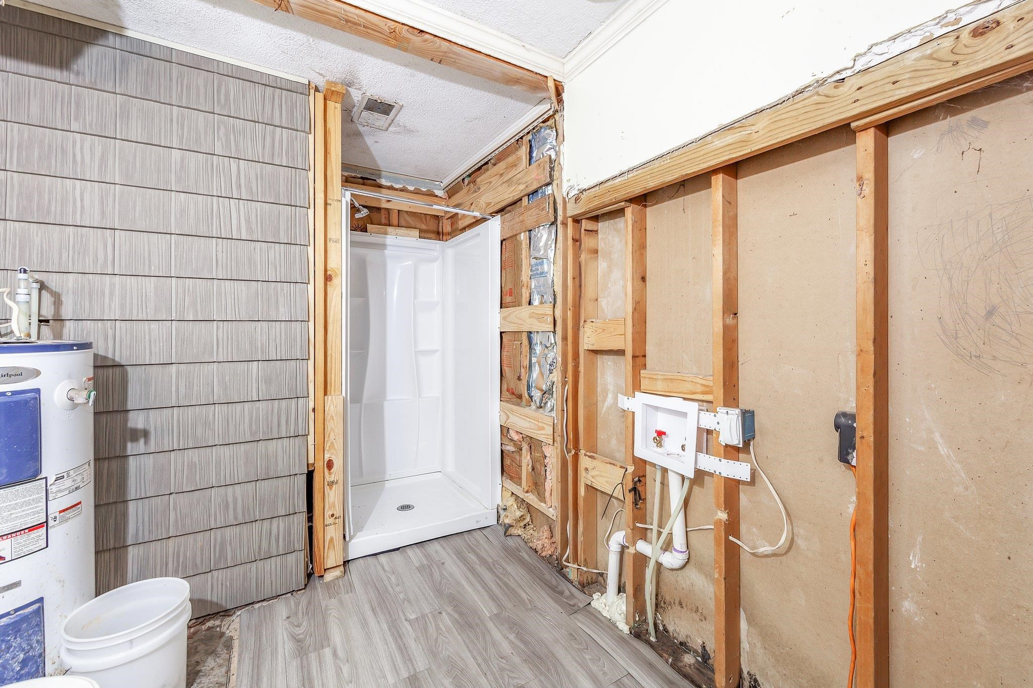3249 Beech Bluff Road Beech Bluff, TN 38313 - Photo 26 of 32 a bathroom with a shower and a glass door