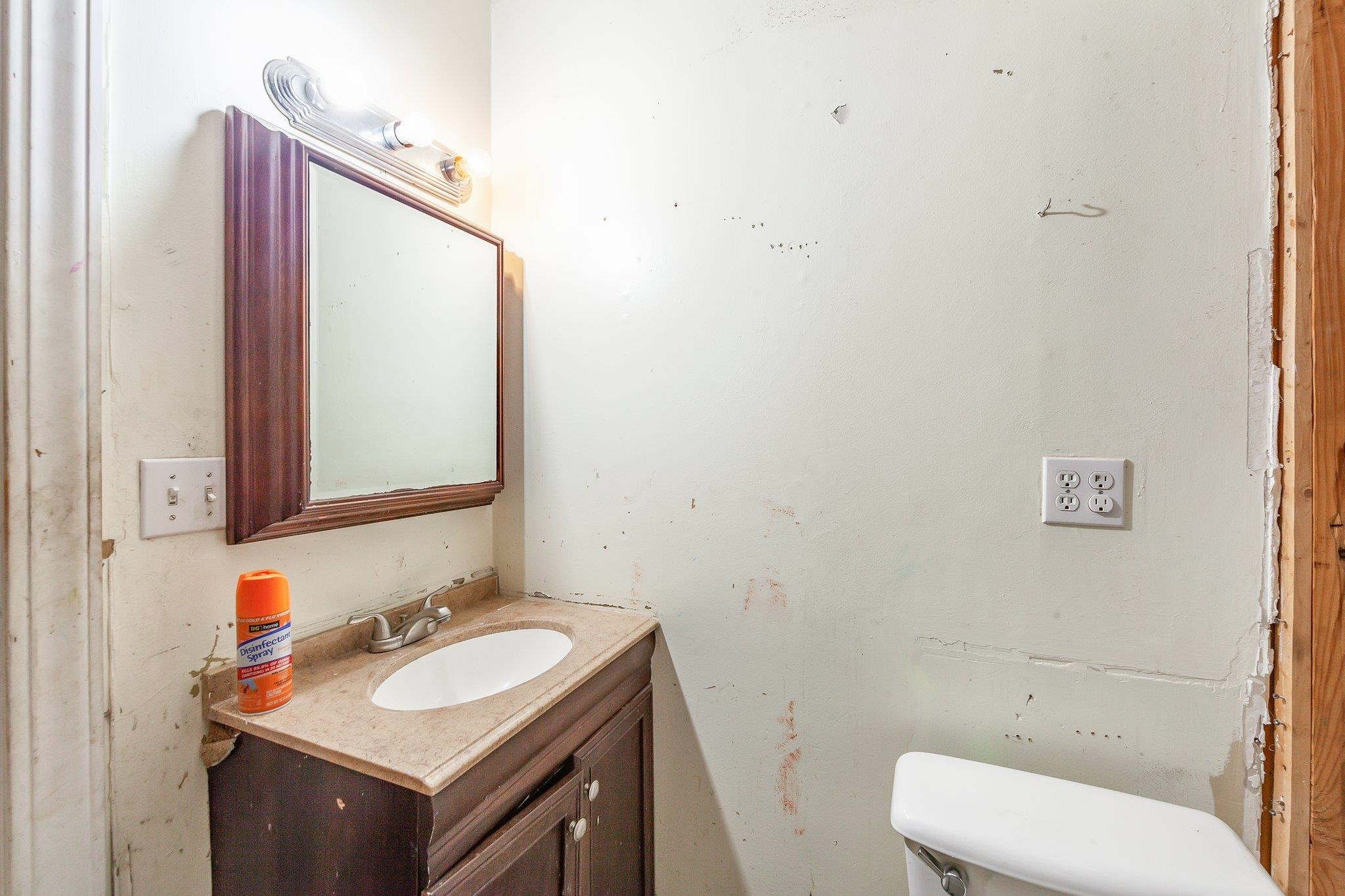 3249 Beech Bluff Road Beech Bluff, TN 38313 - Photo 27 of 32 a bathroom with a toilet sink and mirror