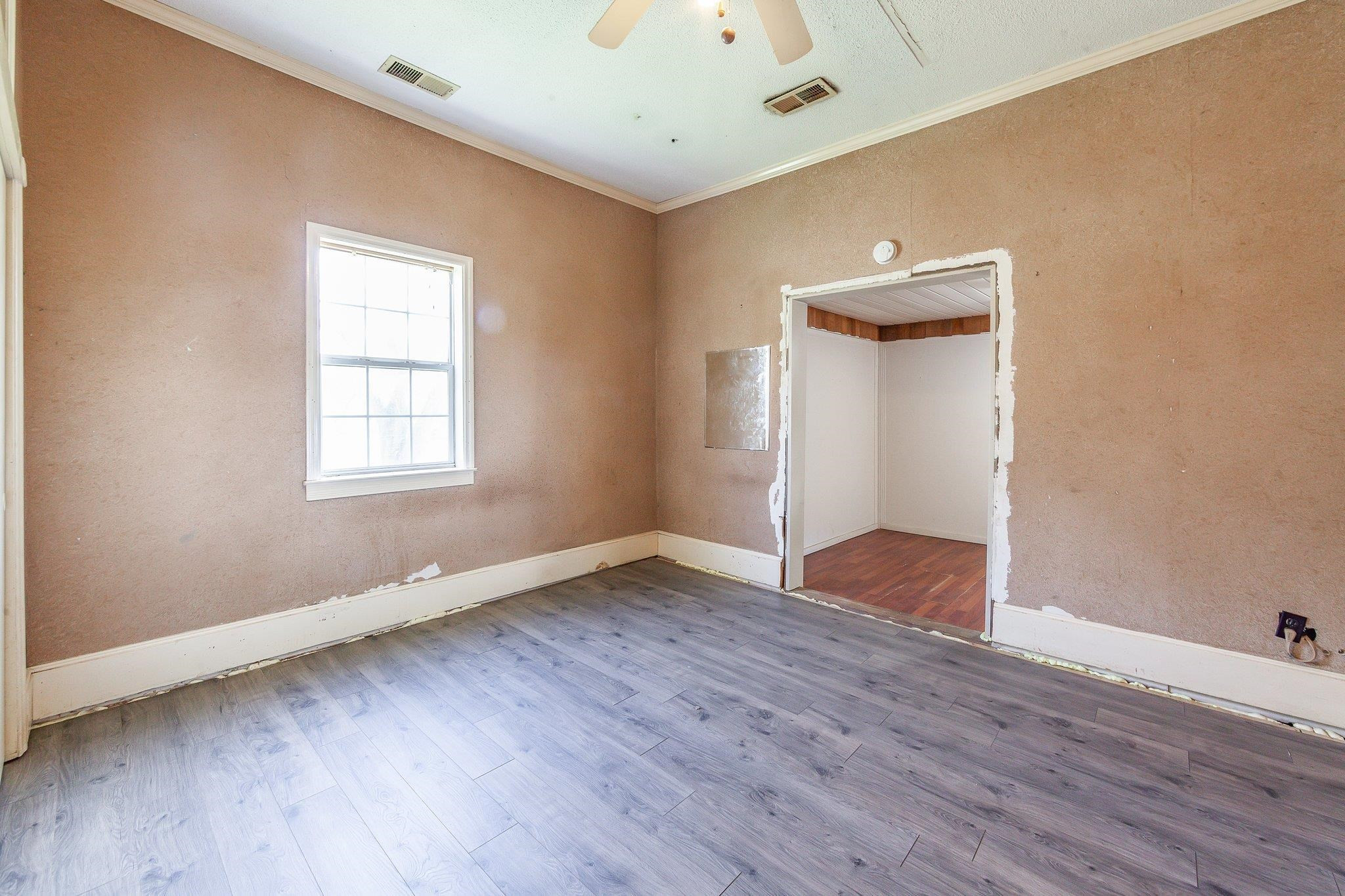 3249 Beech Bluff Road Beech Bluff, TN 38313 - Photo 29 of 32 an empty room with wooden floor and windows