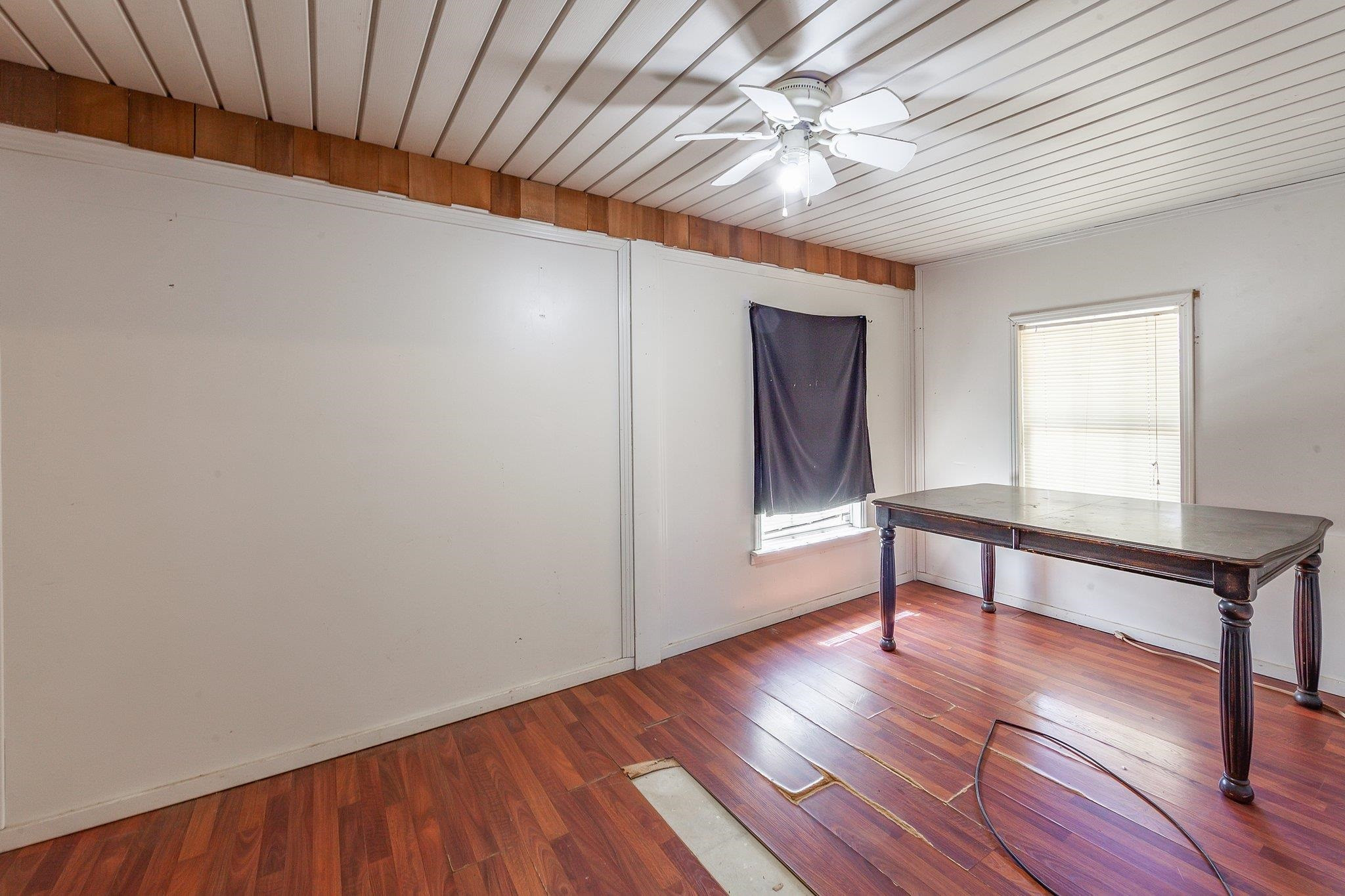 3249 Beech Bluff Road Beech Bluff, TN 38313 - Photo 30 of 32 a view of an empty room with wooden floor and a window