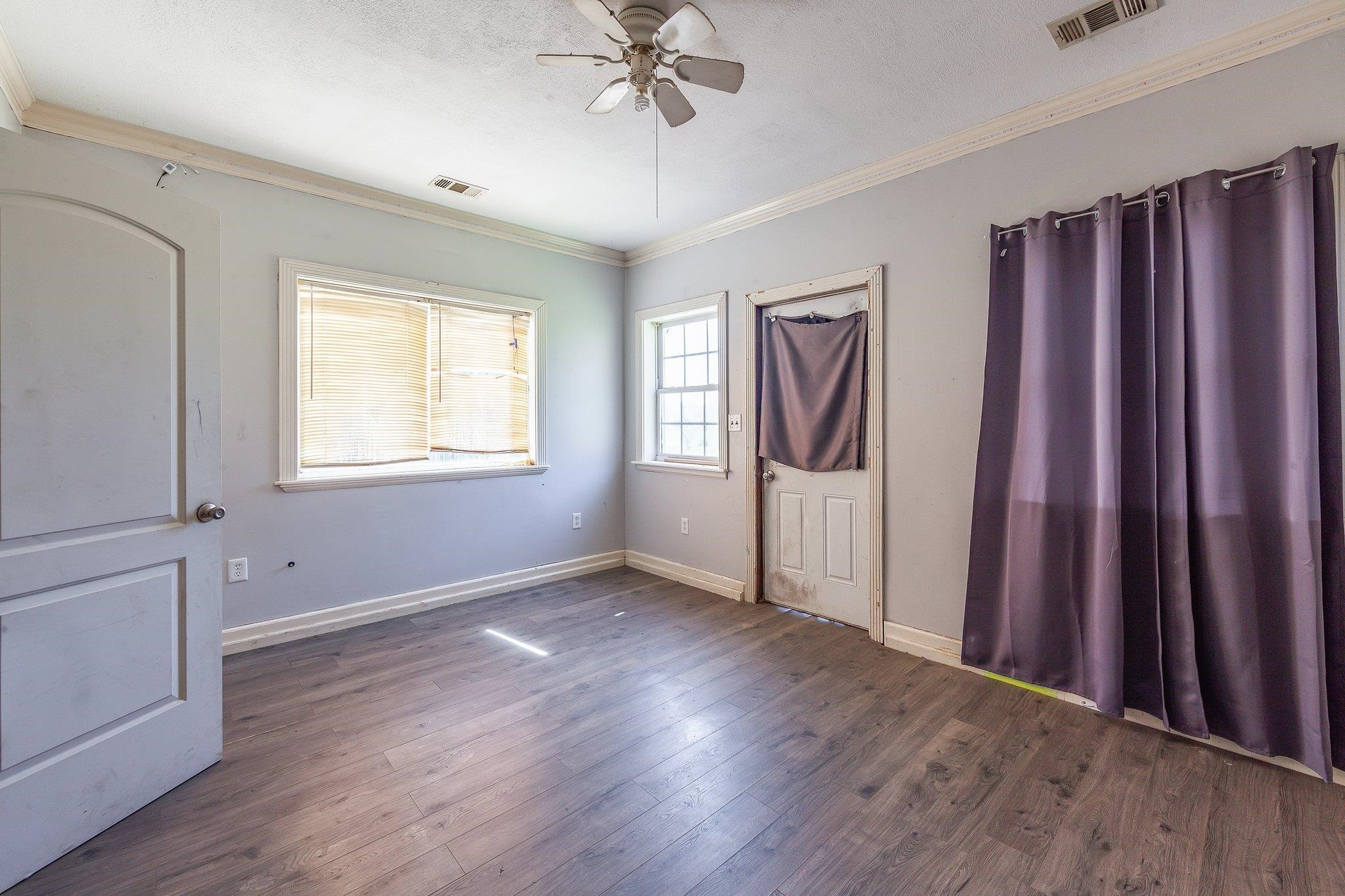 3249 Beech Bluff Road Beech Bluff, TN 38313 - Photo 31 of 32 an empty room with wooden floor closet and windows