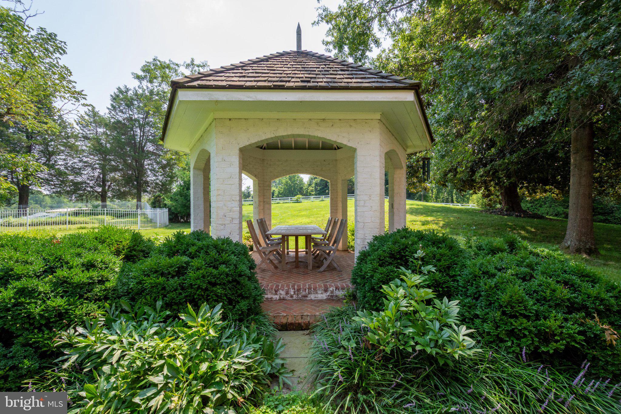 246 Mill Swamp Road Edgewater, MD 21037 - Photo 22 of 29 Charming gazebo in lush greenery.