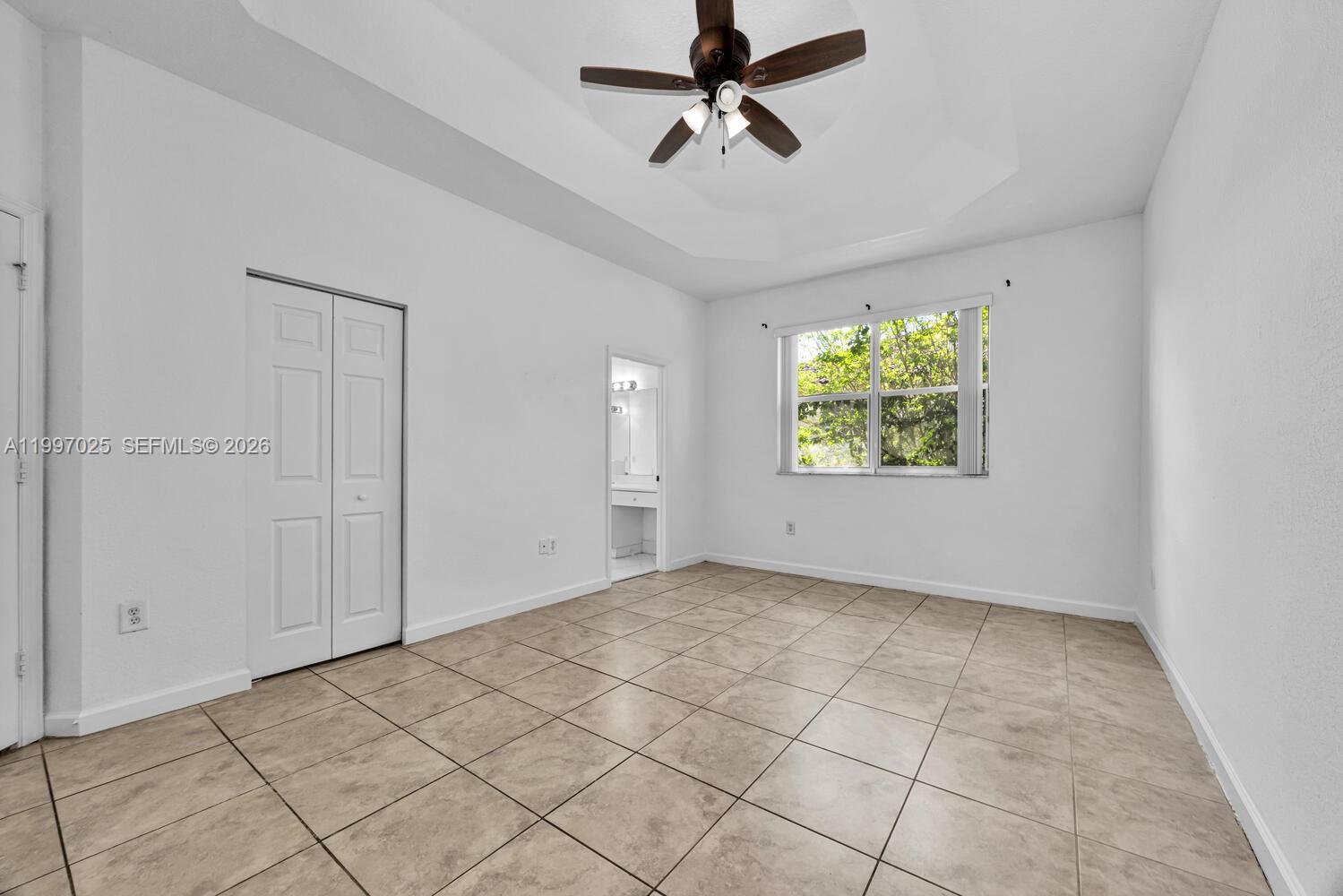 12864 Southwest 133rd Terrace Miami, FL 33186 - Photo 11 of 26 a view of an empty room with a window