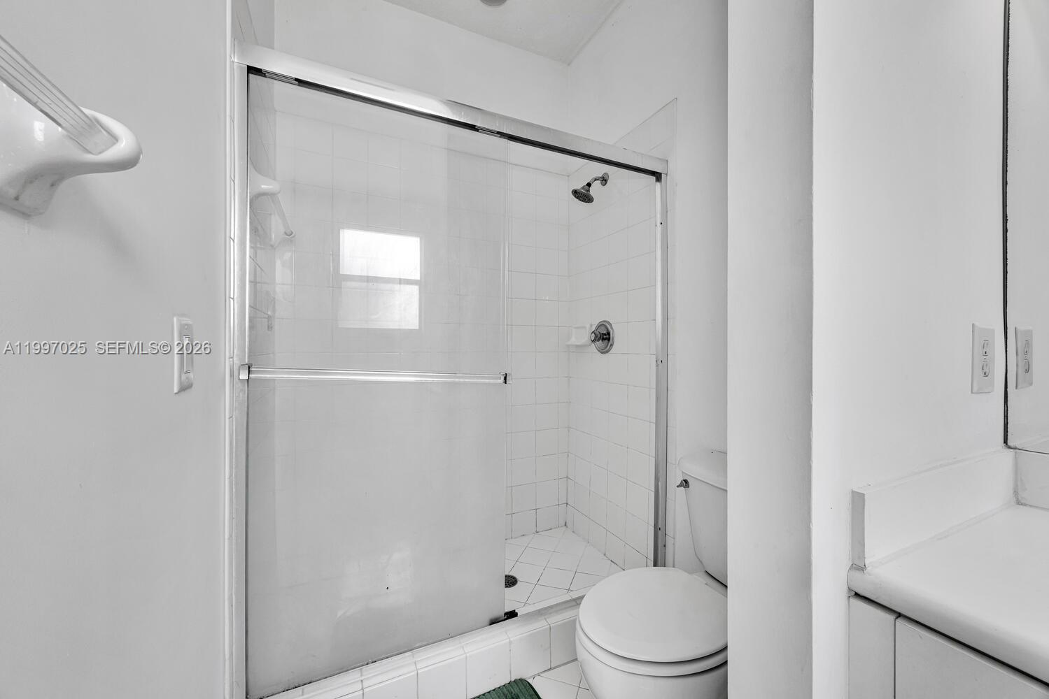 12864 Southwest 133rd Terrace Miami, FL 33186 - Photo 14 of 26 a bathroom with a toilet and a shower